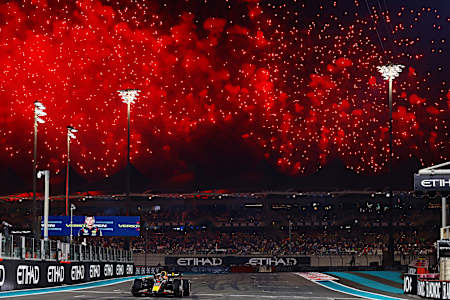Race winner Max Verstappen takes the chequered flag during the F1 Grand Prix of Abu Dhabi at Yas Marina Circuit on November 26, 2023 in Abu Dhabi, United Arab Emirates.