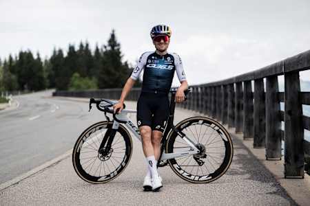 Tom Pidcock stands with his racing bike during Red Bull Sound of Tarmac in Berchtesgaden, Germany, on June 3, 2025, showcasing adrenaline-fuelled road cycling action.