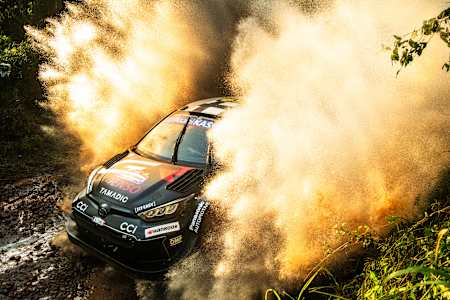 In 2025, Kalle Rovanperä and Jonne Halttunen blast through water in Encarnacion, Paraguay, driving the Red Bull-liveried Toyota Gazoo Racing WRT at the World Rally Championship Paraguay.