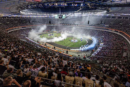 Spectacular drifting action thrills a packed crowd at the 2025 Red Bull Drift Masters Grand Finale in Warsaw, Poland, as smoke fills the stadium and competitors display high-octane skills