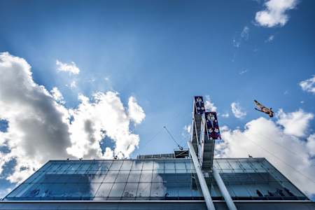James Lichtenstein of the USA dives from the 27 metre platform at the Institute of Contemporary Art, Boston during the Red Bull Cliff Diving World Series final stop