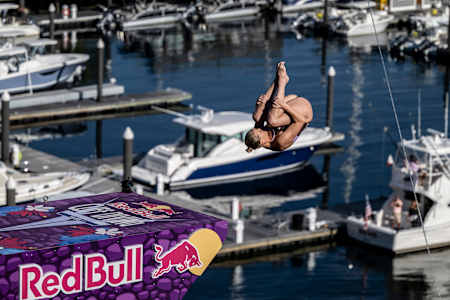 Rhiannan Iffland of Australia performs a high dive from the 21-metre platform atop the Institute of Contemporary Art during the Red Bull Cliff Diving World Series finale in Boston, USA, 2025