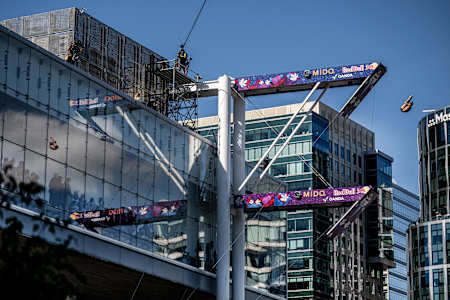 David Colturi of the USA performs a dramatic dive from the 27-metre platform atop Boston's Institute of Contemporary Art during the final stop of Red Bull Cliff Diving World Series 2025