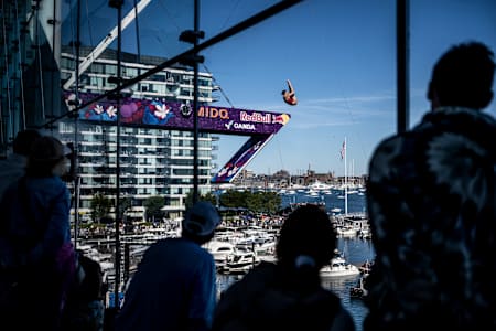 Simone Leathead of Canada dives from the 21-metre platform at the Red Bull Cliff Diving World Series 2025 in Boston, thrilling crowds by the waterfront on the final stop of the season