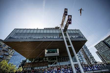 Cătălin Preda of Romania leaps from the 27-metre platform atop Boston’s Institute of Contemporary Art during the dynamic Red Bull Cliff Diving World Series final stop on 20 September 2025