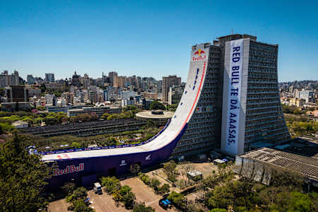 Pro skater Sandro Dias speeds down the epic Red Bull Building Drop mega ramp in Porto Alegre, Brazil, on September 25, 2025, shining at this iconic city event