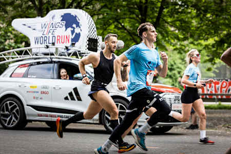 Athletes push their limits along the streets of Vienna during the 2025 Red Bull Wings for Life World Run, with the iconic catcher car in pursuit