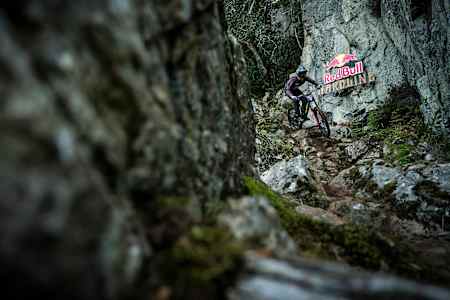 Dan Booker rides his bike in the rock garden at Red Bull Hardline in Wales