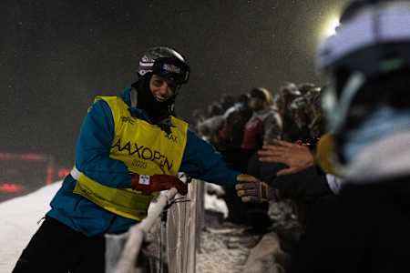 Scotty James, wearing his Red Bull helmet, connects with passionate fans at the Laax Open 2023 in Laax, Switzerland, bringing energy and excitement to the snowboarding event