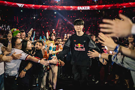 Faker of T1 greets fans during the 2025 Red Bull League of Its Own at SAP Garden in Munich, Germany, surrounded by a vibrant esports crowd