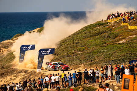 Elfyn Evans and Scott Martin drive through a dusty coastal Wolf Power stage at the World Rally Championship in Alghero, Italy, in October 2026