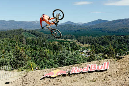 Jackson Goldstone launches into the air during practice at Red Bull Hardline 2026 in Maydena Bike Park, Australia.