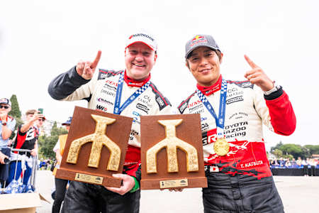 Takamoto Katsuta holds his winner's trophy aloft to celebrate first place at the 2026 World Rally Championship in Rijeka, Croatia.