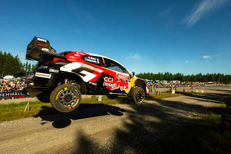 Sébastien Ogier and Julien Ingrassia launch the Toyota Gazoo Racing World Rally Team car over a gravel jump during the 2026 World Rally Championship in Jyväskylä, Finland.