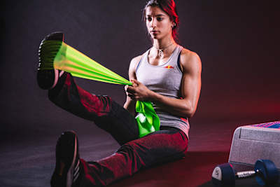 This assisted stretch with elastic band targets the hamstrings in depth.