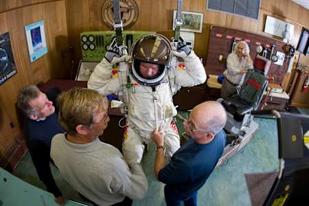 Felix Baumgartner tries on a spacesuit at the David Clark Company.
