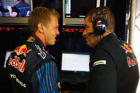 Sebastian Vettel And Rocky Chat In The Garage
