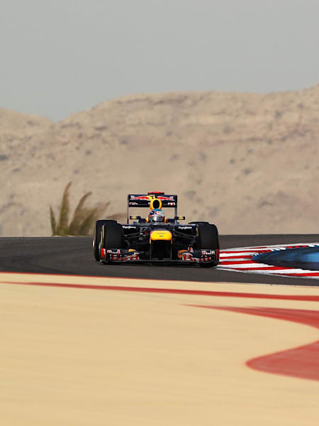 Sebastian Vettel and Kimi Raikkonen drive during the 2012 Bahrain Grand Prix.