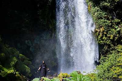 One of the riders marvels at a crashing waterfall
