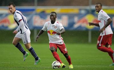 Naby Keita of Red Bull Salzburg controls the ball during the friendly match between Red Bull Salzburg and West Brom on July 8, 2015 in Schladming, Austria.