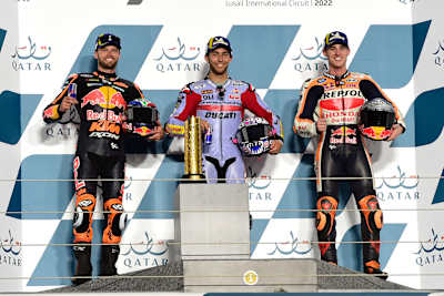 L-R: Brad Binder, Enea Bastianini and Pol Espargaro on the podium after the MotoGP race in Qatar.