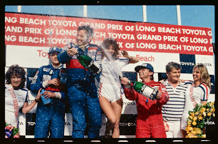 In 1983, Northern Irishman John Watson of McLaren celebrates at the U.S.G.P. in Long Beach, where he marched from 22nd to 1st place—which remains as the biggest grid to win spread in F1 history.