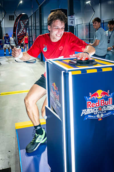 A Jordania competitor plays fiercely at the Red Bull Padel Dash World Final 2025 in Sevilla, showcasing athleticism and the energetic spirit of the Red Bull brand