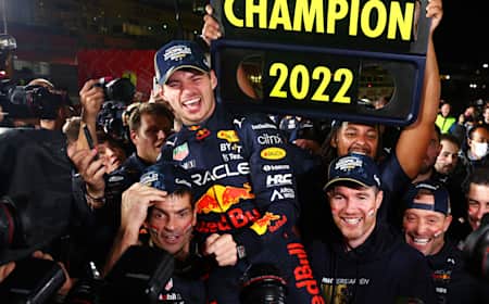 Max Verstappen, race winner and 2022 F1 World Drivers Champion, celebrates with his team after the F1 Grand Prix of Japan at Suzuka International Racing Course on October 09, 2022 in Suzuka, Japan.
