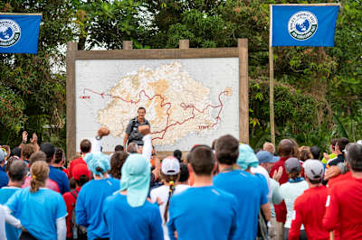 Eco-Challenge racers listen to guidance from Bear Grylls.