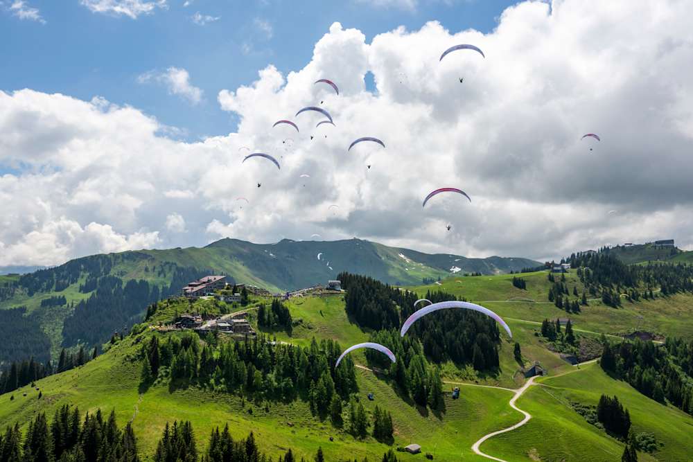 Athletes flying around Hahnenkamm, Austria during Red Bull X-Alps 2023