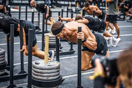 Man pushing weights at the Hyrox World Championships 2023