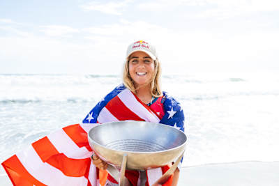 Caroline Marks and the world surfing champion trophy. 