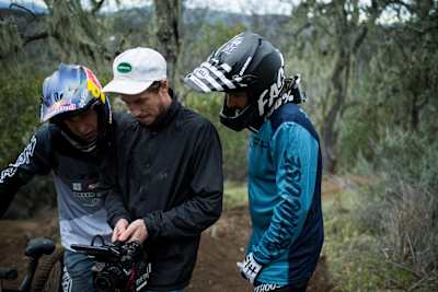 Brandon Semenuk, Ryan Howard and Rupert Walker discuss film footage during the filming of Parallel, the latest MTB film by Revel Co., in California, USA.