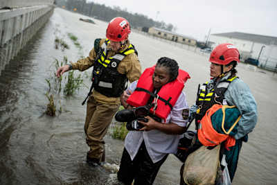 Volunteers rescue a survivor of Hurricane Harvey, which caused catastrophic flooding in Texas and Louisiana in August 2017.