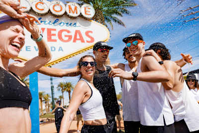 Team Bandit (with Kam Casey in black, centre) celebrating at the finish line of The Speed Project running relay race.