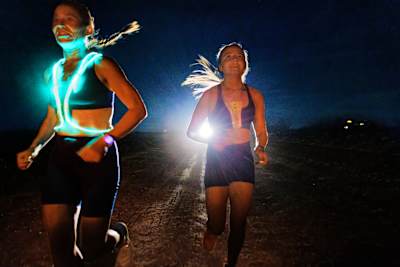 Good to glow: Two members of Team Lululemon approach Barstow, undeterred by aggressive truck drivers and wild dogs.