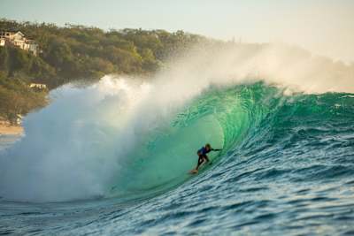 Erin Brooks riding the tube at Padang Padang on her way to a fourth-place finish at the 2022 Rip Curl Cup.