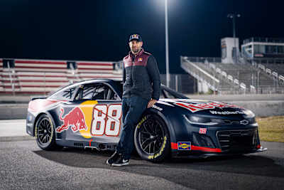 Van Gisbergen poses with his No. 88 Chevrolet with new Red Bull livery