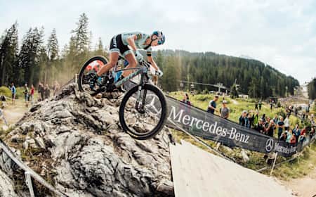 Courtney puts her technical training to the test on a feature at a UCI World Cup race in Lenzerheide, Switzerland, on June 11, 2023.