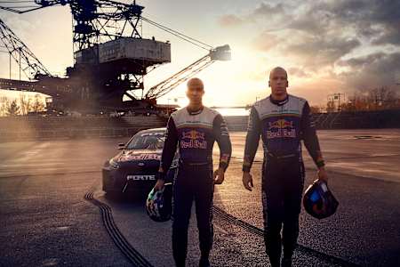 Elias Hountondji (left) and his brother, Joe, emerge from their souped-up Kia Forte drift racing car.