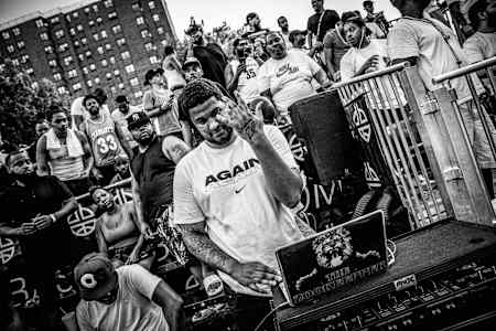 Special Beat Service: As game time approaches at Dyckman, a DJ starts stoking the crowd.