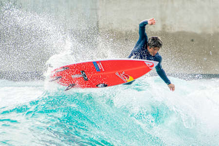 A photograph of Kanoa Igarashi surfing.