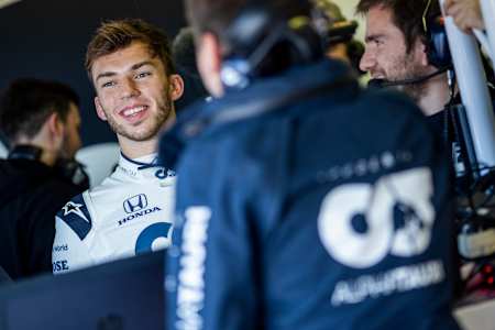Pierre Gasly talks to his Scuderia AlphaTauri mechanic in Misano, Italy on February 15, 2020.