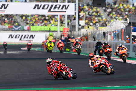 Marc Márquez chases Jack Miller at the start of the Emilia Romagna GP.