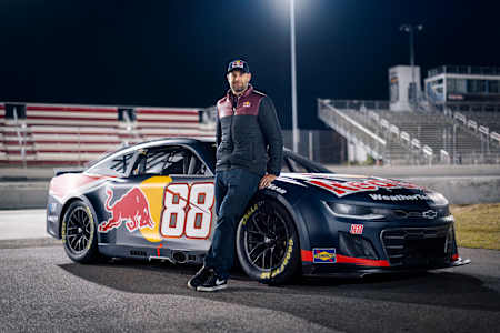Van Gisbergen poses with his No. 88 Chevrolet with new Red Bull livery