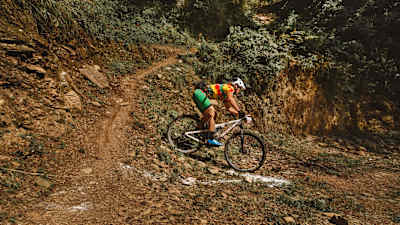 A participant rides a trail at MTB Himalaya.