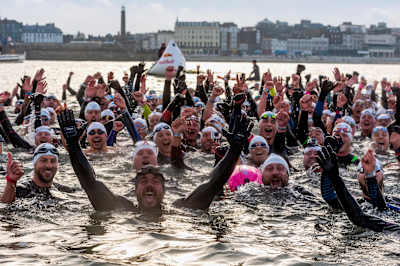 Ross Edgley celebrates the end of his Great British Swim attempt with a group of other swimmers in Margate on November 4, 2018.