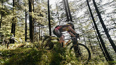 A participant rides a trail at MTB Himalaya.