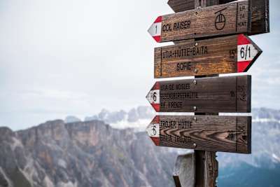 A signpost offering a guide to the waymarked trails of Südtirol.