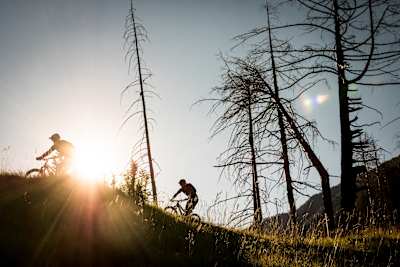 MTB riders Ludo May and Yann Guigoz ride the descent from Hannnigalp to Graechen in Switzerland on June 26, 2018.